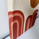 Canvas wrapped in leather and inlayed with dessert scape motif. Light sand color leather background with shades of terracotta post modern art national park landscape desert Moab Utah