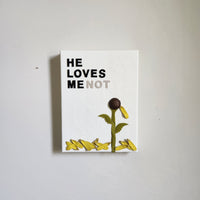 leather wall art word art he loves me not flower petals