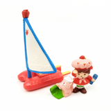 Vintage Original Miniature Strawberry Shortcake Figurine on a sailboat with Custard.