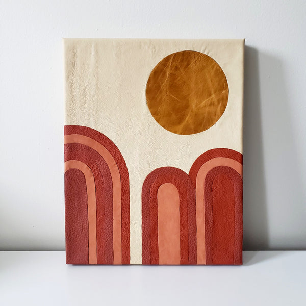 Canvas wrapped in leather and inlayed with dessert scape motif. Light sand color leather background with shades of terracotta post modern art national park landscape desert Moab Utah