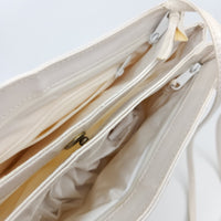 Vintage White Handbag with Strap. Cool details. Interior zipper pocket. Button closure